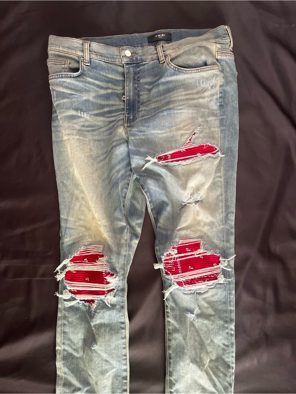 AMIRI Light Blue Skinny Jeans with Red Patch Accents